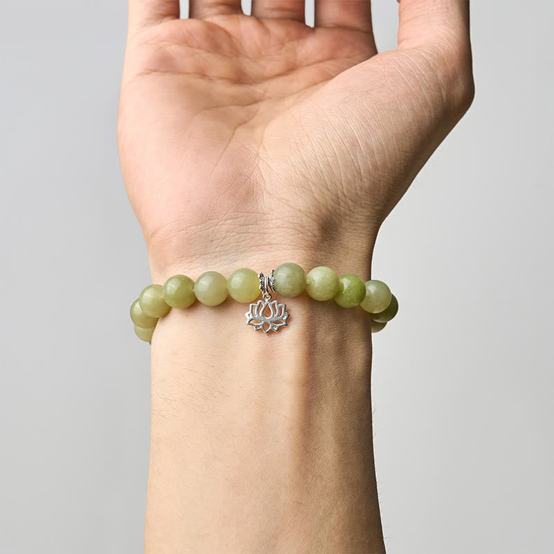 Cyan Jade Lotus Bracelet worn on wrist, natural green gemstone charm bracelet