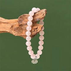 Rose Quartz Lotus Bracelet on natural driftwood, pink gemstone stretch bracelet