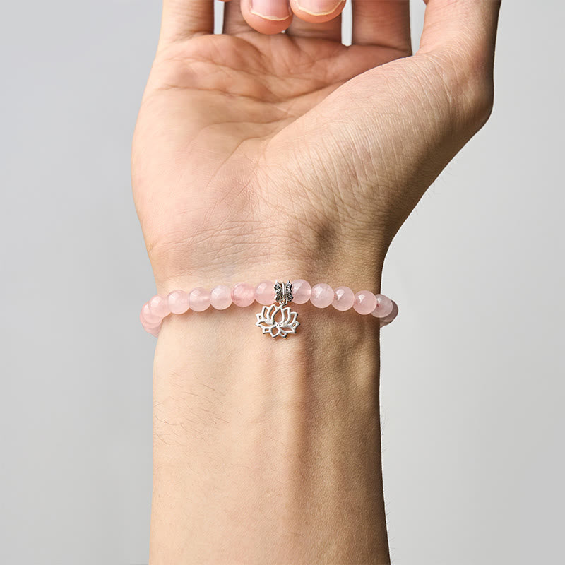 Rose Quartz Lotus Bracelet worn on wrist, pink crystal gemstone charm jewelry