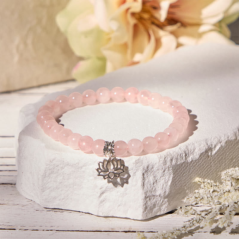 Rose Quartz Lotus Charm Bracelet with baby's breath, feminine pink bead jewelry