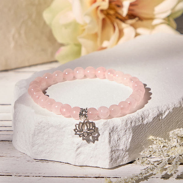 Rose Quartz Lotus Charm Bracelet with baby's breath, feminine pink bead jewelry