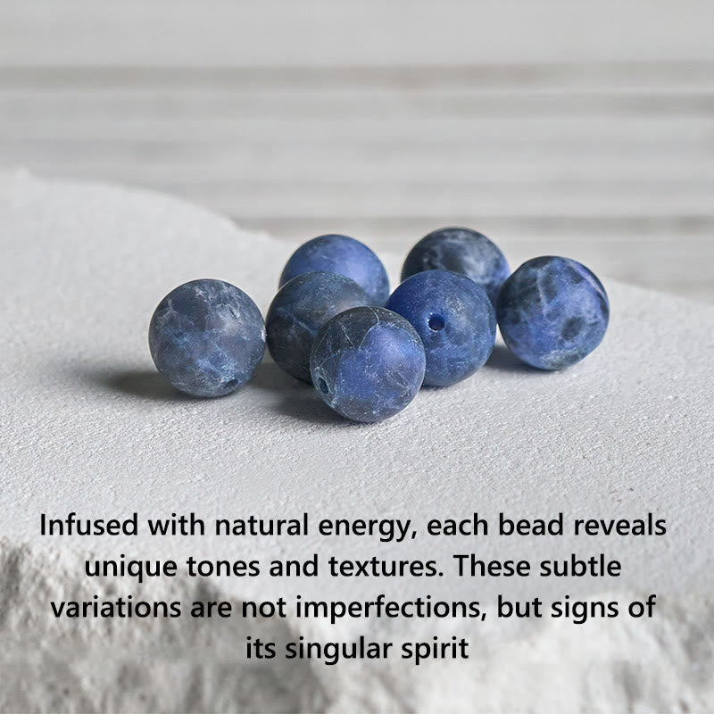 Sodalite Lotus Bracelet – close-up of natural blue sodalite beads showing unique white veining, gemstone bracelet