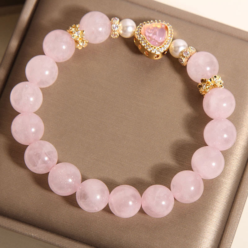 Pink Crystal Pearl Buddha Bracelet – angled flatlay showing bead texture and Buddha charm from above, detail