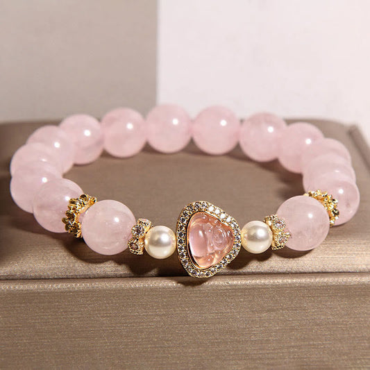 Pink Crystal Pearl Buddha Bracelet – closeup front showing smooth pink crystal beads and Buddha centerpiece, macro