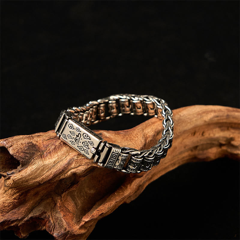 Copper Auspicious Clouds Om Mani Padme Hum Bracelet – Intricate chain links over driftwood, copper spiritual jewelry