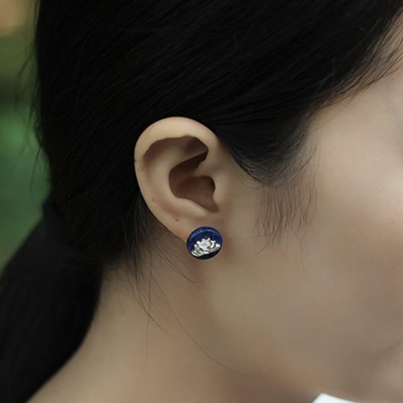 Lapis Lazuli Lotus Earring – side profile worn on ear among green foliage, silver lotus on blue stone