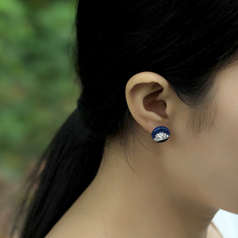 Lapis Lazuli Lotus Stud – three-quarter head view wearing earring with blurred nature background, lifestyle