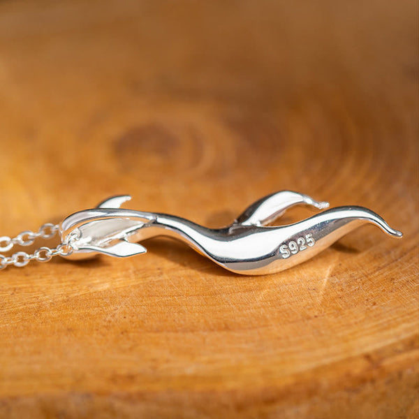Silver Golden Koi Fish Luck Necklace – close-up S925 stamp on koi pendant, sterling silver on wood surface
