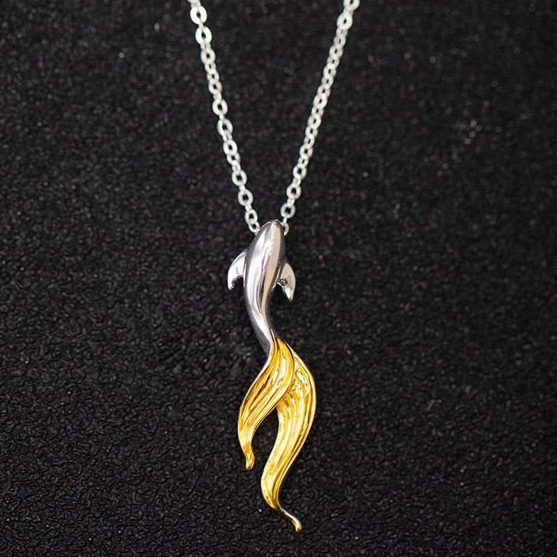 Silver Golden Koi Fish Luck Necklace – two-tone pendant with silver body and gold flowing tail on black bg