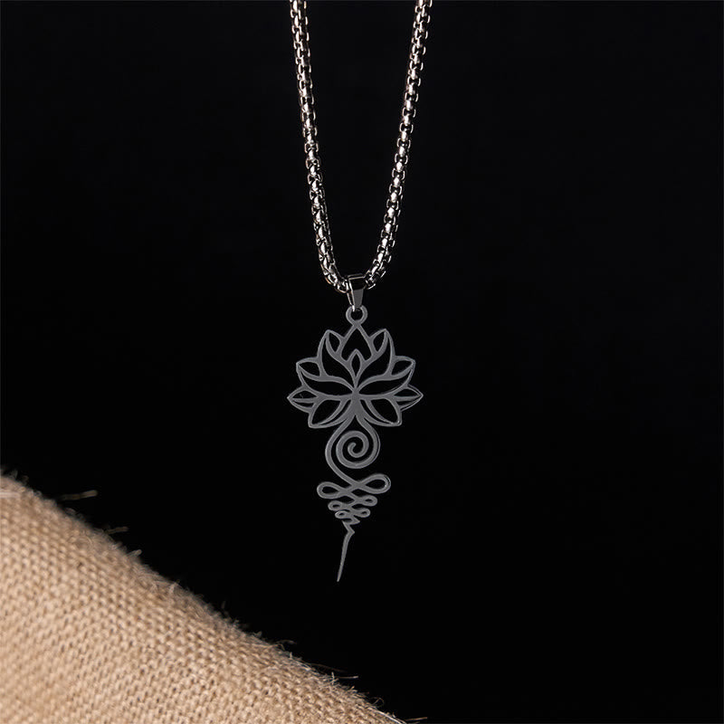 Lotus Unalome Necklace – Blackened silver lotus-unalome cutout pendant on black, mindfulness chakra jewelry