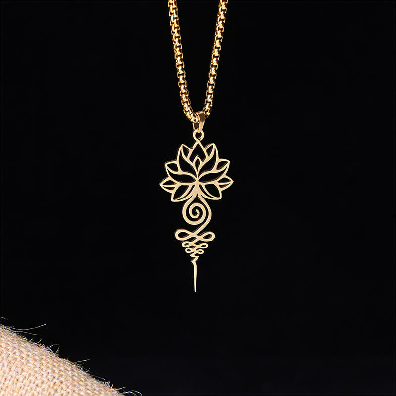 Lotus Unalome Chakra Necklace – Gold cutout lotus-unalome pendant on box chain, black backdrop, chakra pendant