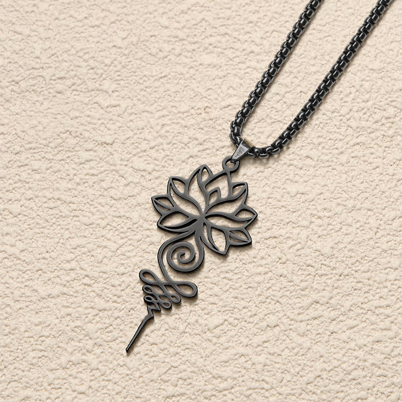 Lotus Unalome Chakra Necklace – Dark gunmetal lotus-unalome openwork pendant on cream, spiritual necklace
