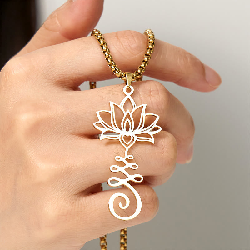 Chakra Lotus Necklace – Gold lotus-unalome pendant held in hand showing size, enlightenment necklace