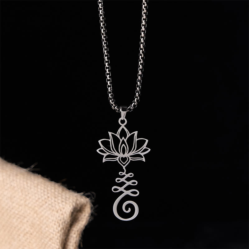 Chakra Lotus Necklace – Silver lotus heart pendant on black backdrop, enlightenment necklace
