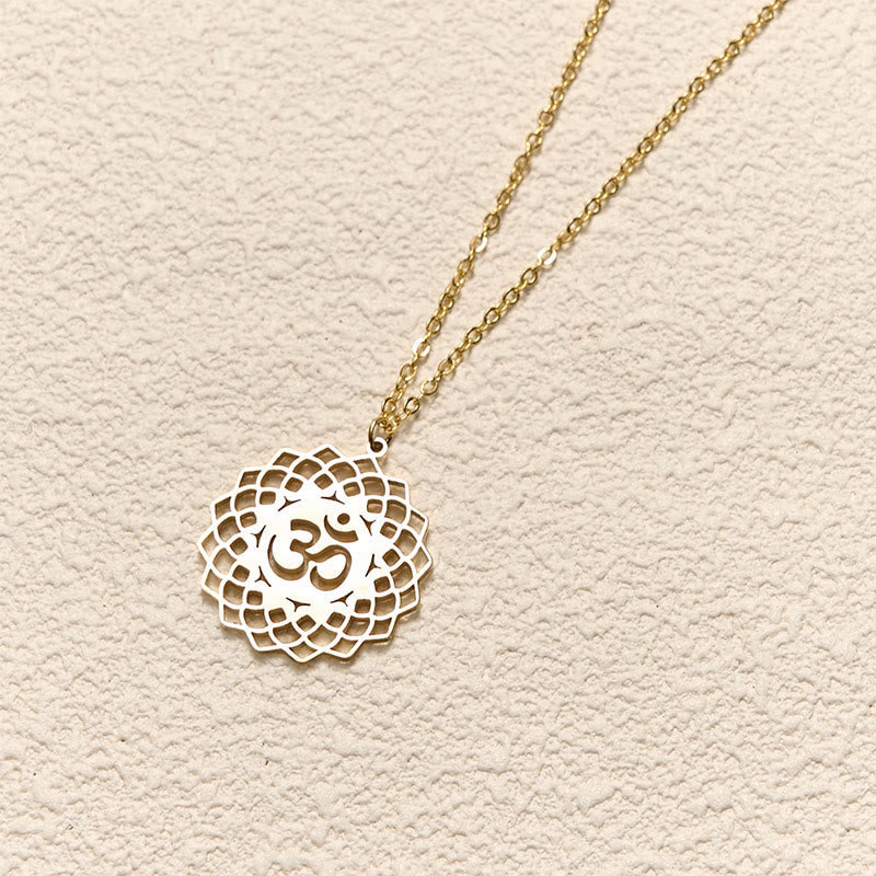 Gold Om lotus cutout necklace on cable chain, yoga jewelry