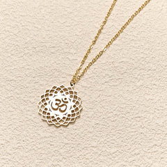Gold Om lotus cutout necklace on cable chain, yoga jewelry