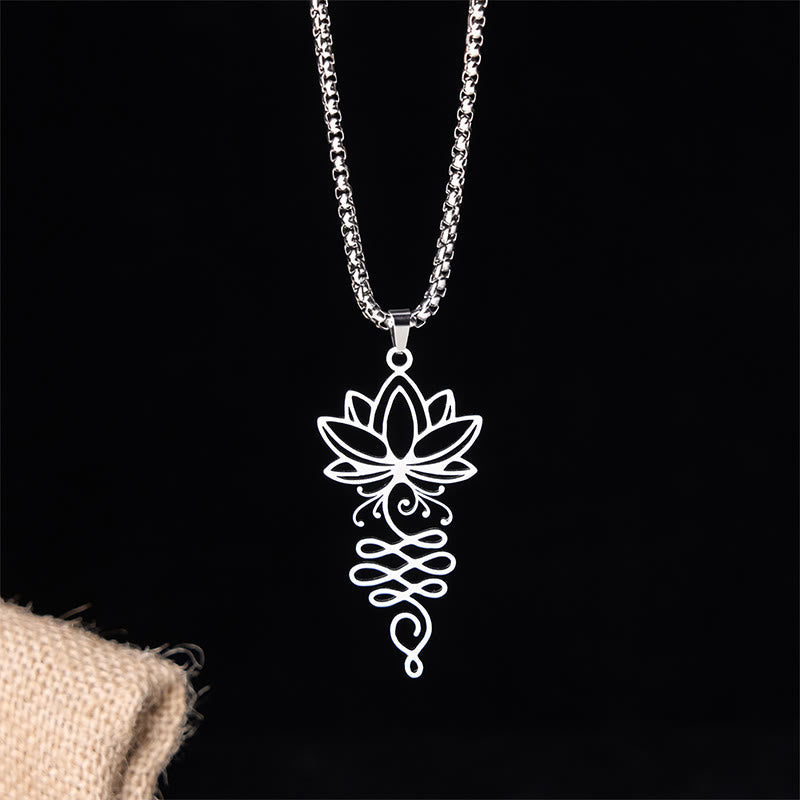 Lotus Vines Chakra Necklace – Silver lotus pendant with unalome symbol on black backdrop, enlightenment jewelry