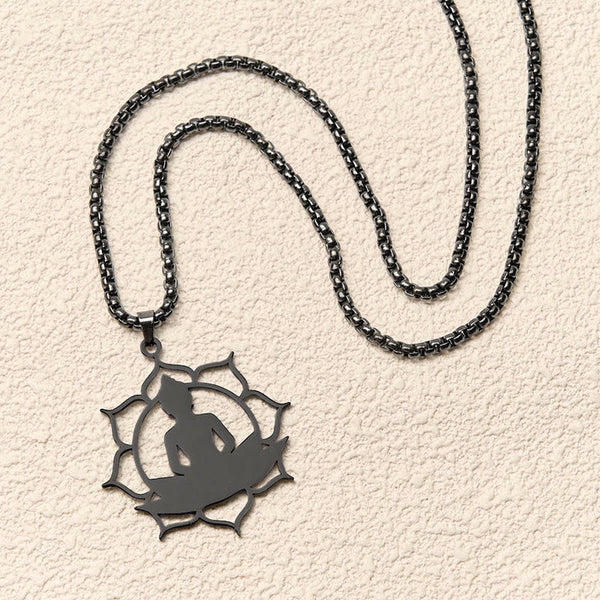 Vintage Lotus Sitting Buddha Stainless Steel Necklace – floating on mirror surface, reflective symmetrical artistic shot