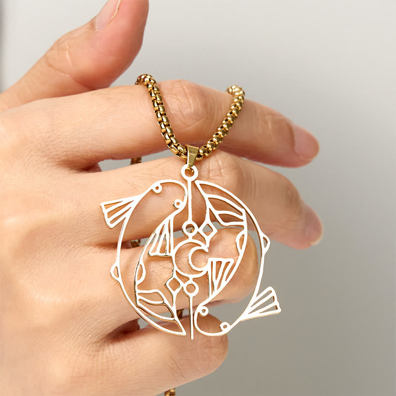 Vintage Koi Fish Hollow Luck Necklace – gold koi pendant held in hand, three-quarter view, neutral bg