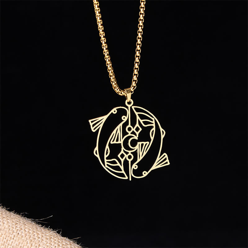Vintage Koi Fish Hollow Luck Necklace – gold yin-yang koi pendant, front view on black with burlap accent