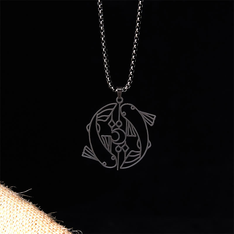 Vintage Koi Fish Hollow Luck Necklace – black yin-yang koi pendant, front view on black with burlap accent