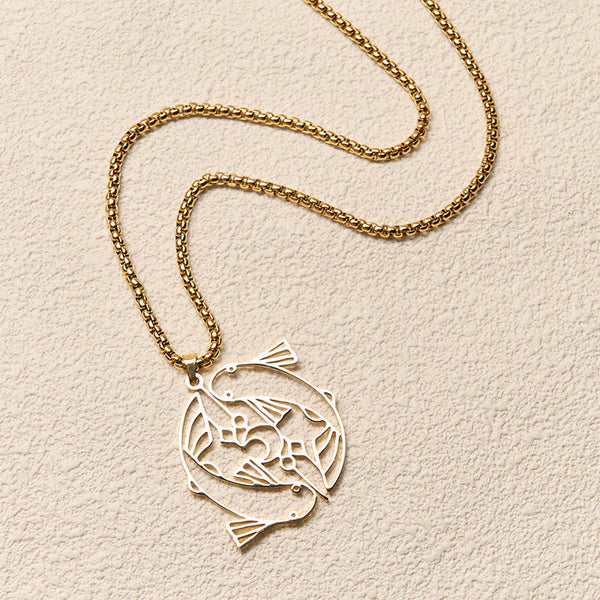 Vintage Koi Fish Hollow Luck Necklace – gold koi pendant, diagonal flat-lay on cream textured background