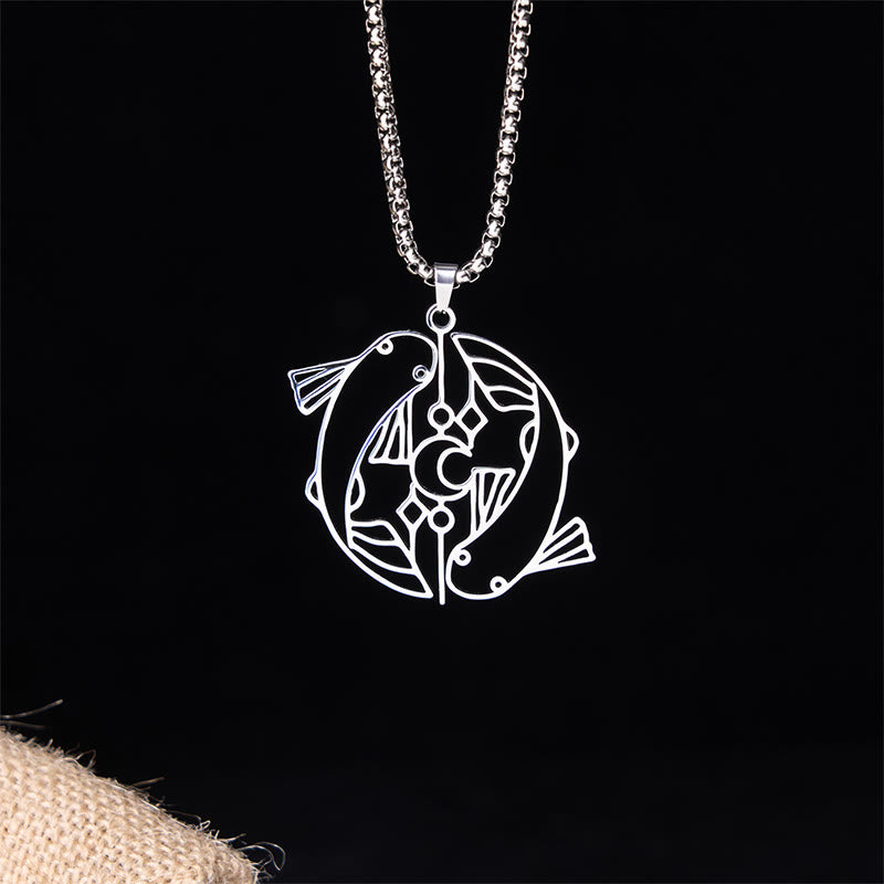 Vintage Koi Fish Hollow Luck Necklace – silver yin-yang koi pendant, front view on black with burlap accent