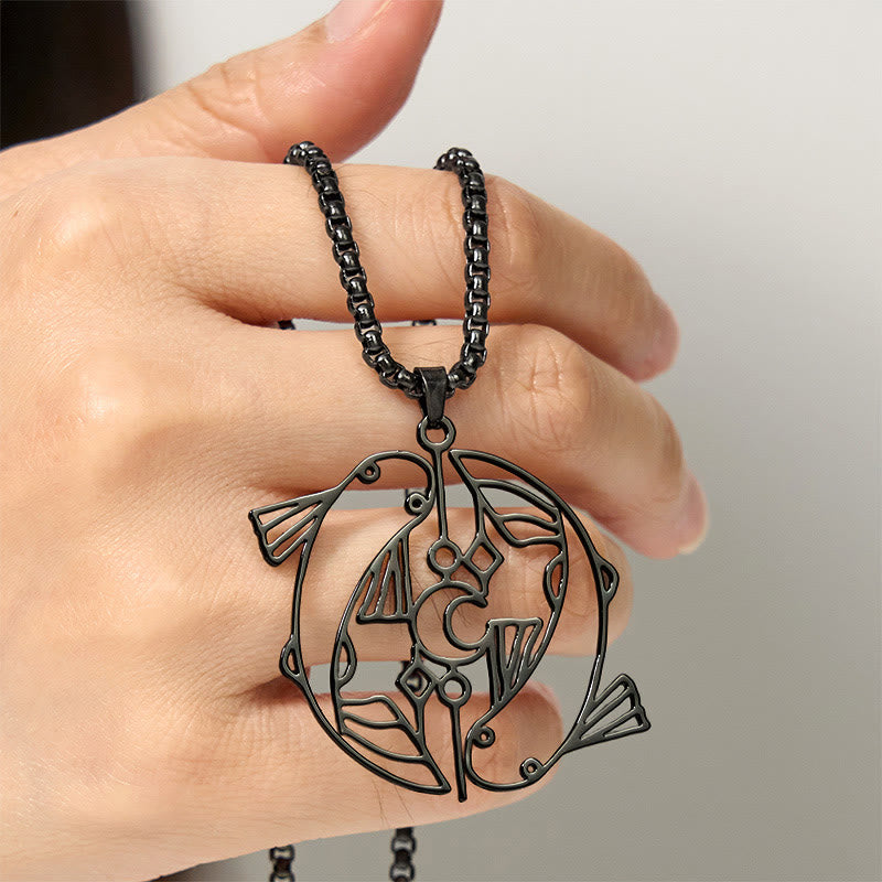 Vintage Koi Fish Hollow Luck Necklace – black koi pendant held in hand, neutral gradient background