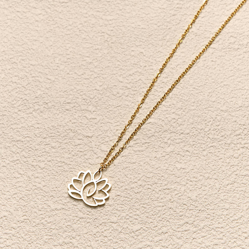 Hollow Lotus Necklace – Two-tone gold chain with silver lotus pendant on cream, enlightenment jewelry