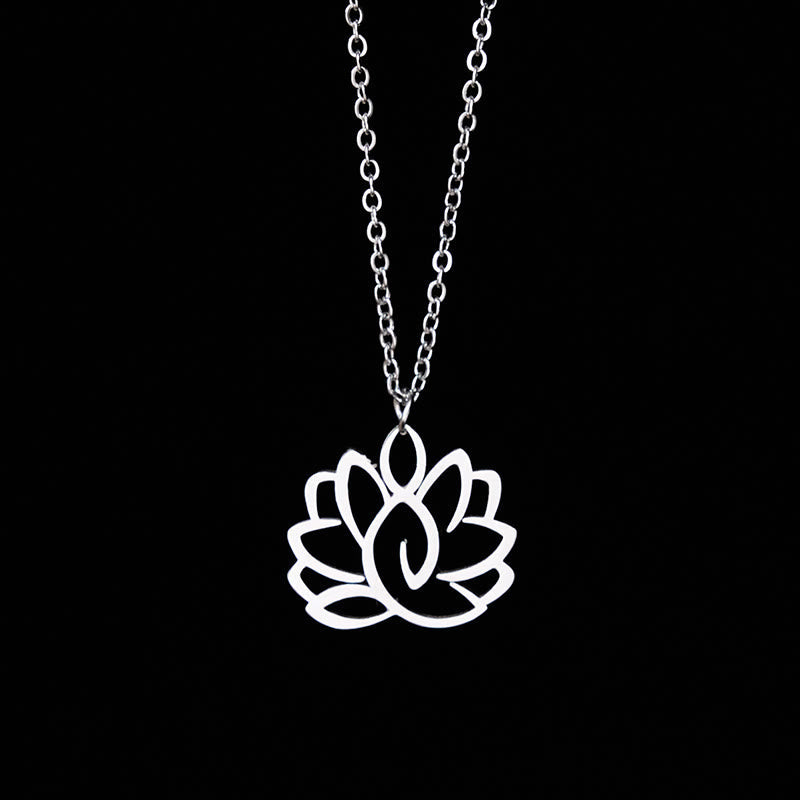 Hollow Lotus Necklace – Silver openwork lotus pendant on chain against black, enlightenment jewelry