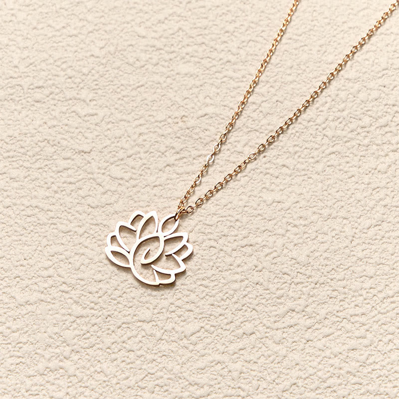 Hollow Lotus Necklace – Rose gold lotus pendant on chain at angled view, enlightenment purity jewelry