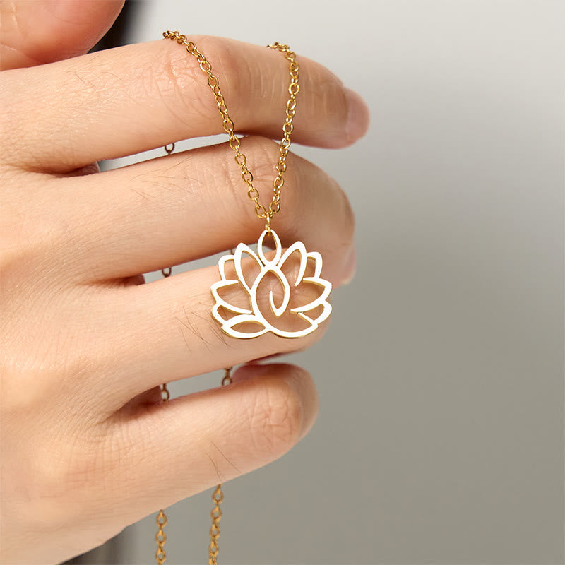 Hollow Lotus Necklace – Gold lotus pendant held between fingers showing openwork, spiritual purity pendant