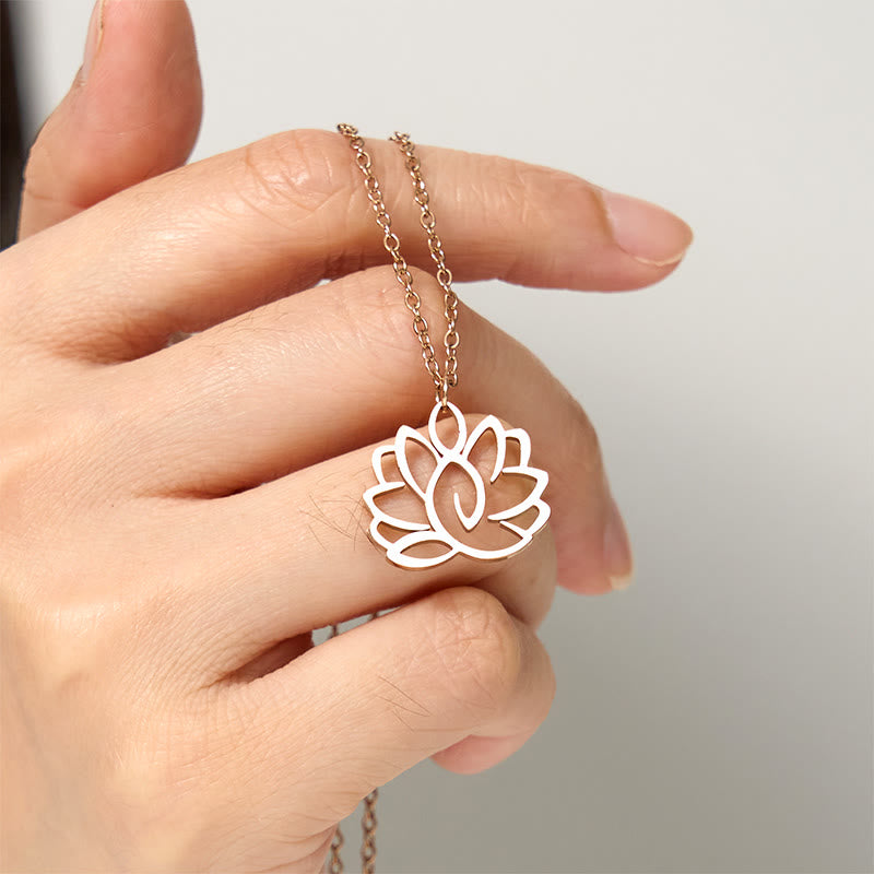 Hollow Lotus Necklace – Rose gold lotus pendant held in hand close-up, spiritual enlightenment jewelry
