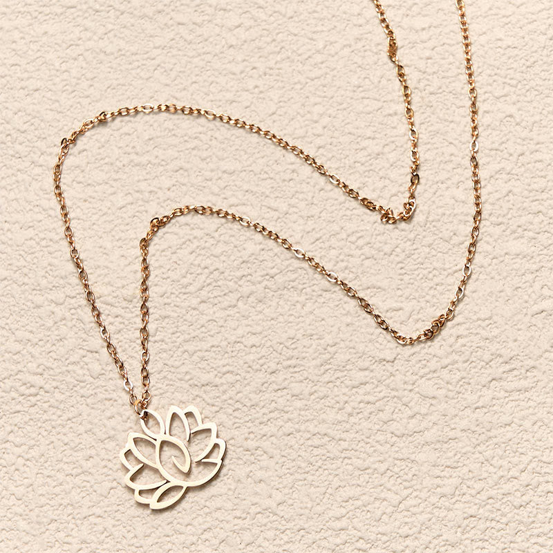 Hollow Lotus Necklace – Rose gold openwork lotus pendant on textured cream, spiritual purity necklace