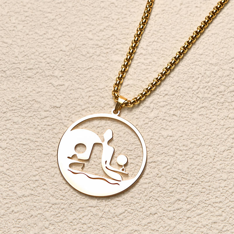 Yin Yang Buddha Stainless Steel Necklace – angled cream background gold Buddha yin yang pendant chain, angled