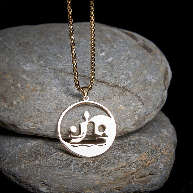 Yin Yang Buddha Stainless Steel Necklace – on gray stones dark background gold Buddha yin yang pendant, natural-light