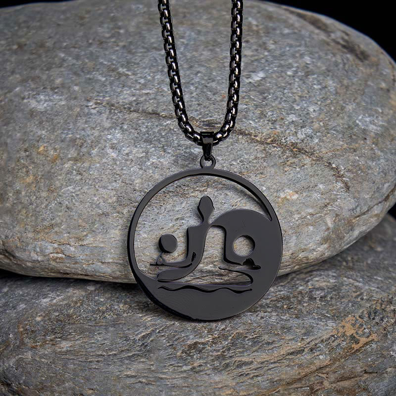 Yin Yang Buddha Stainless Steel Necklace – on gray stones dark background black Buddha yin yang pendant, natural-light