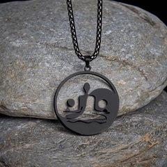 Yin Yang Buddha Stainless Steel Necklace – on gray stones dark background black Buddha yin yang pendant, natural-light