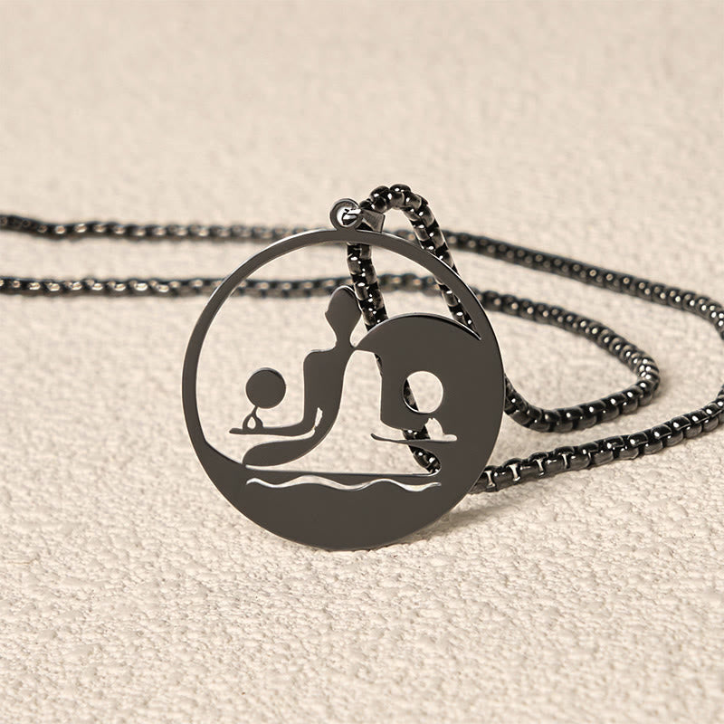 Yin Yang Buddha Stainless Steel Necklace – closeup black pendant edge chain cutout Buddha yin yang detail, texture
