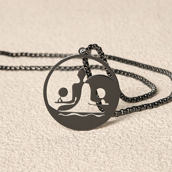 Yin Yang Buddha Stainless Steel Necklace – closeup black pendant edge chain cutout Buddha yin yang detail, texture