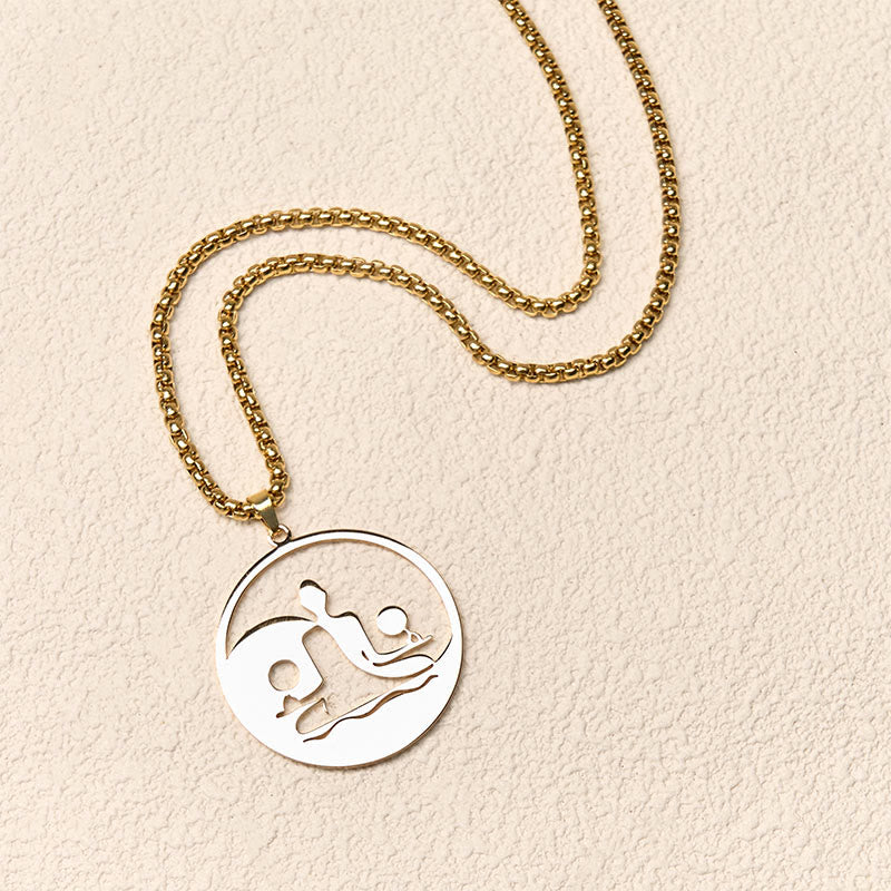 Yin Yang Buddha Stainless Steel Necklace – flatlay cream texture gold chain round Buddha yin yang pendant, flat-lay
