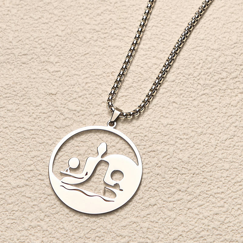 Yin Yang Buddha Stainless Steel Necklace – angled cream background silver Buddha yin yang pendant chain, angled