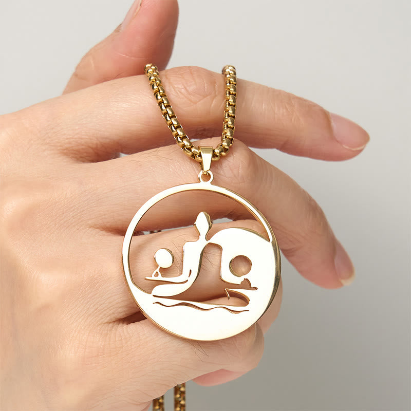 Yin Yang Buddha Stainless Steel Necklace – held hand light background gold Buddha yin yang pendant scale, hand-held