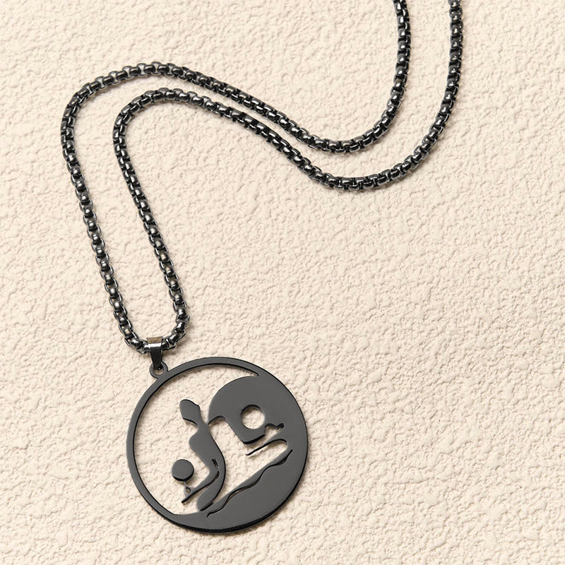 Yin Yang Buddha Stainless Steel Necklace – flatlay cream texture black chain round Buddha yin yang pendant, flat-lay