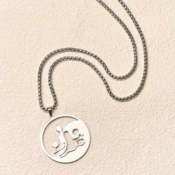 Yin Yang Buddha Stainless Steel Necklace – flatlay cream texture silver chain round Buddha yin yang pendant, flat-lay