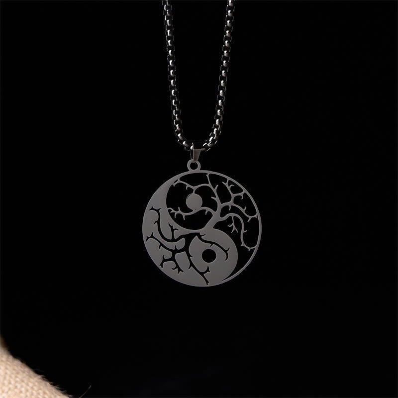 Yin Yang Branches Necklace – Black pendant on solid black background, yin yang necklace