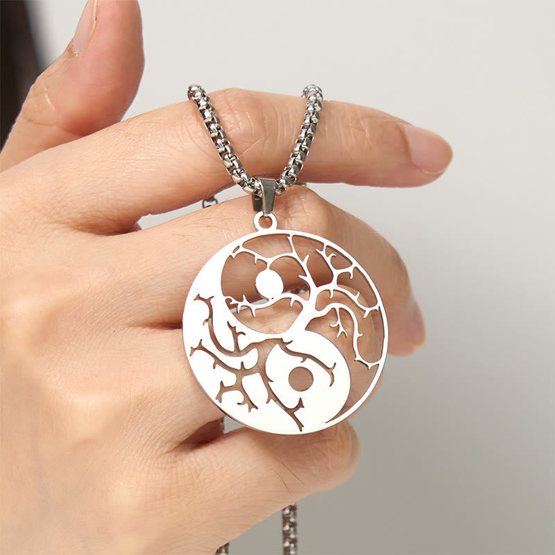 Yin Yang Branches Necklace – Silver pendant held by hand, balance harmony necklace