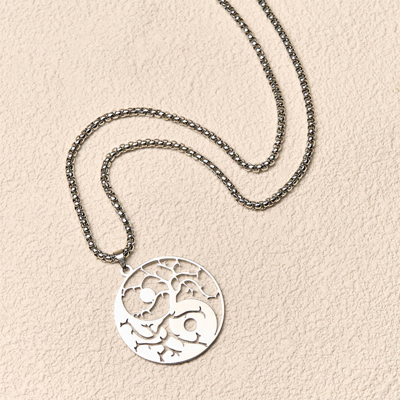 Yin Yang Branches Necklace – Silver tree of life pendant flat lay, yin yang jewelry
