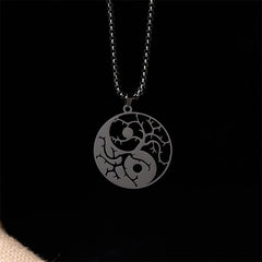 Yin Yang Branches Necklace – Black pendant on solid black background, yin yang necklace
