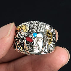 Half Demon Half Buddha Lotus Copper Ring – hand held closeup with demon Buddha detail, red turquoise gems